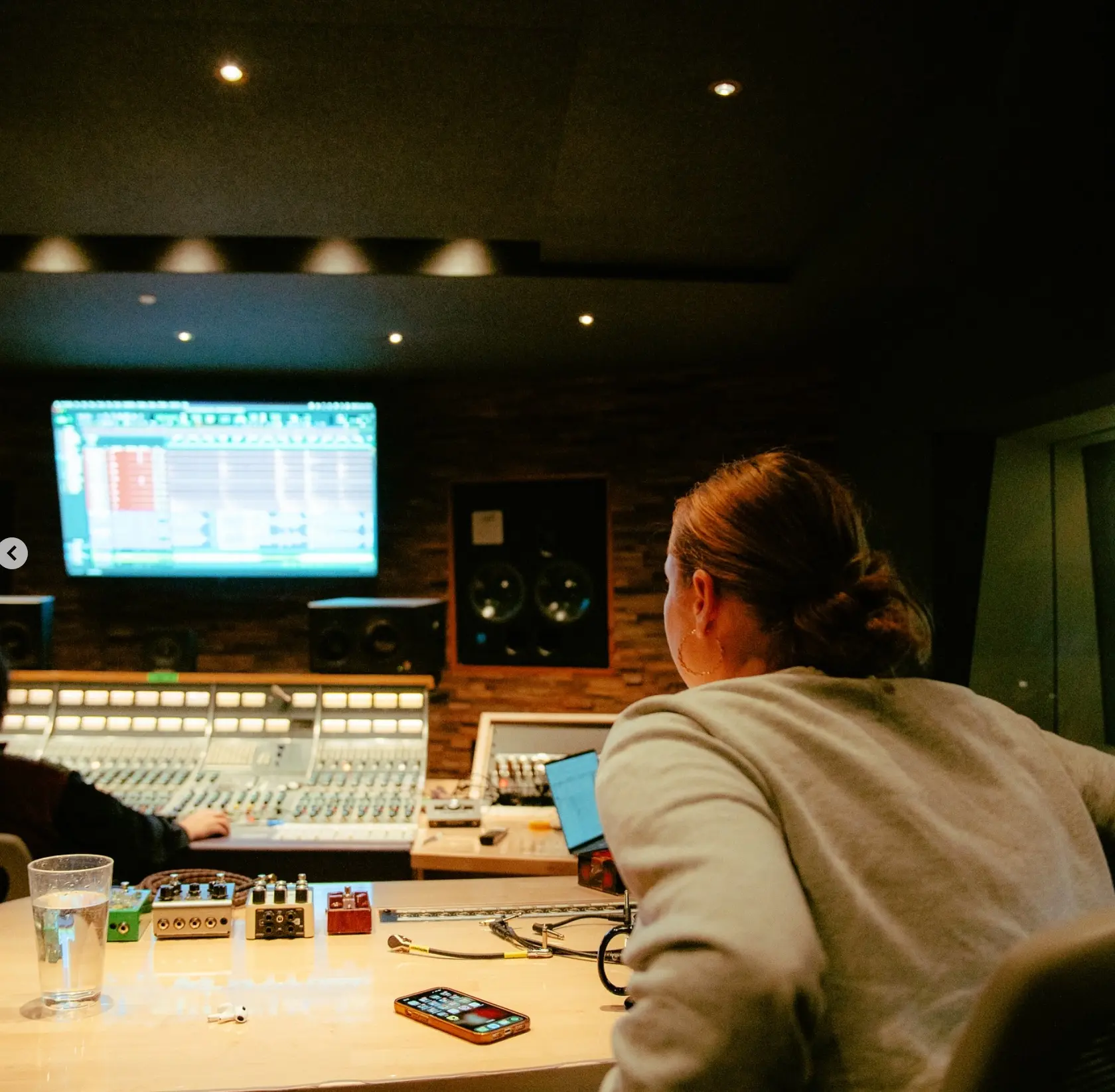 Producer working at the Salvation Studios mixing console