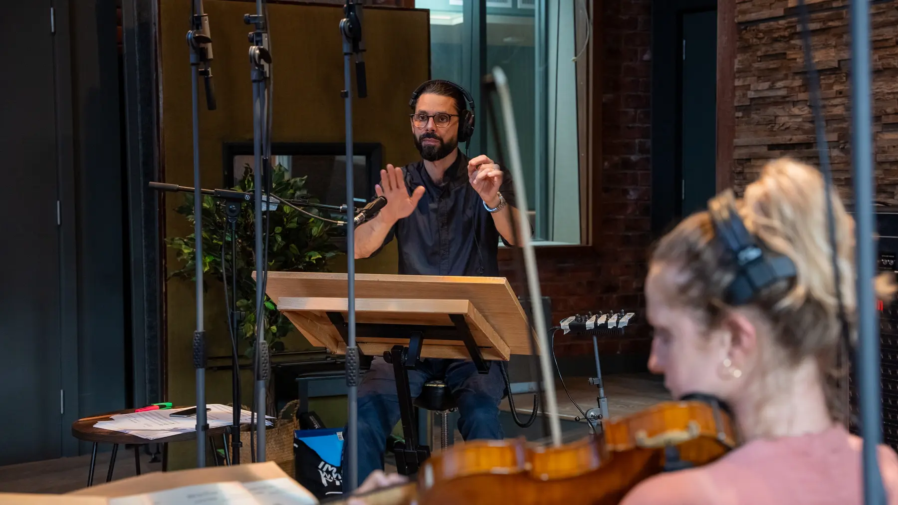 Vocalist performing with a string player at Salvation Studios